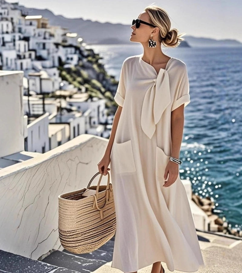 ANITA | Abito ampio con fiocco al collo e tasche pratiche