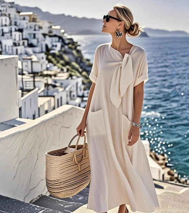 ANITA | Abito ampio con fiocco al collo e tasche pratiche